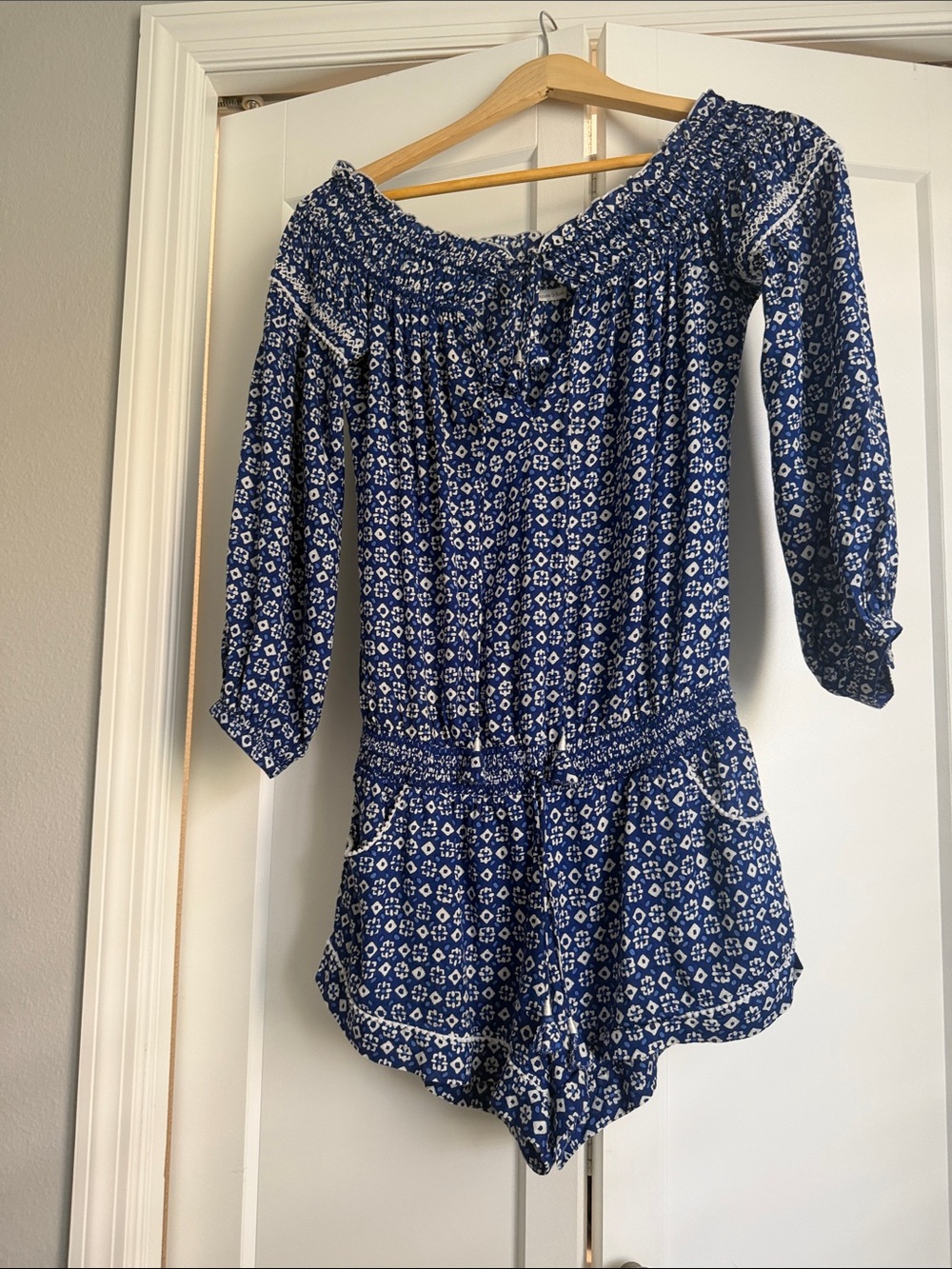 Poupette St. Barth Blue and White Floral Off-Shoulder Romper
